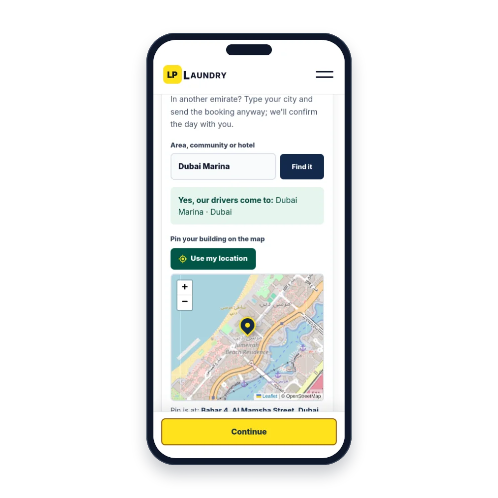 The LP Laundry booking page on a phone, with a Dubai Marina pickup pinned on the map