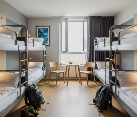 Hostel bunk room made up with freshly laundered bed linen